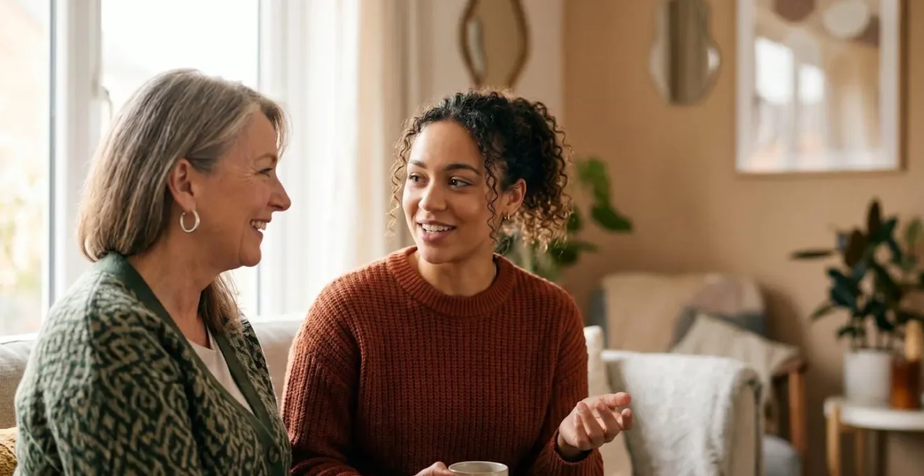 Warm professional interaction between UK landlord and tenant discussing property matters in comfortable home setting