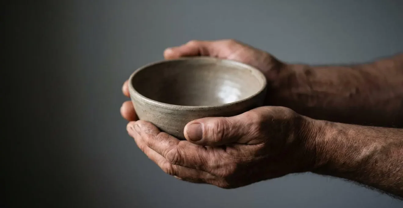 A pair of hands holding an empty bowl, symbolising the financial drain and emotional exhaustion caused by the minimum payment trap.